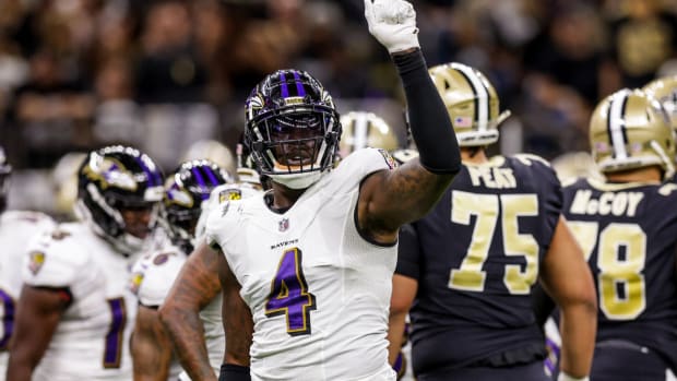 Nov 7, 2022; New Orleans, Louisiana, USA; Baltimore Ravens linebacker Jason Pierre-Paul (4) signals a 4th down stop against the New Orleans Saints during the first half at Caesars Superdome. Mandatory Credit: Stephen Lew-USA TODAY Sports  